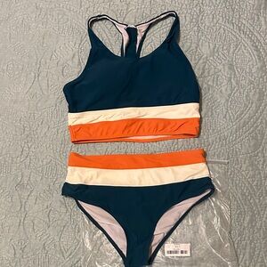 NWOT Colorblock Bikini Set. Padded racer back top and high-rise waist bottom.